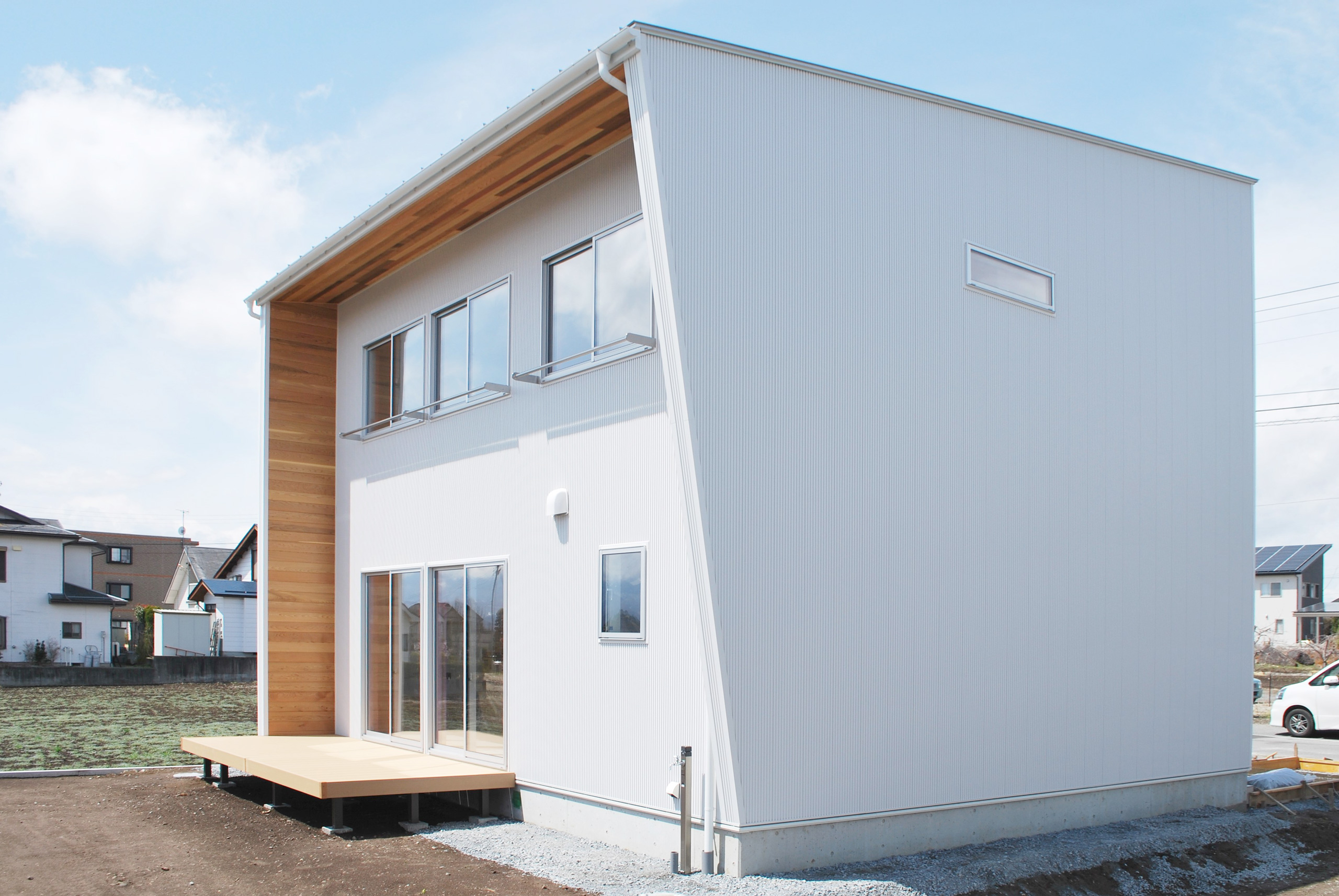Wood deck and eaves, wood siding facade