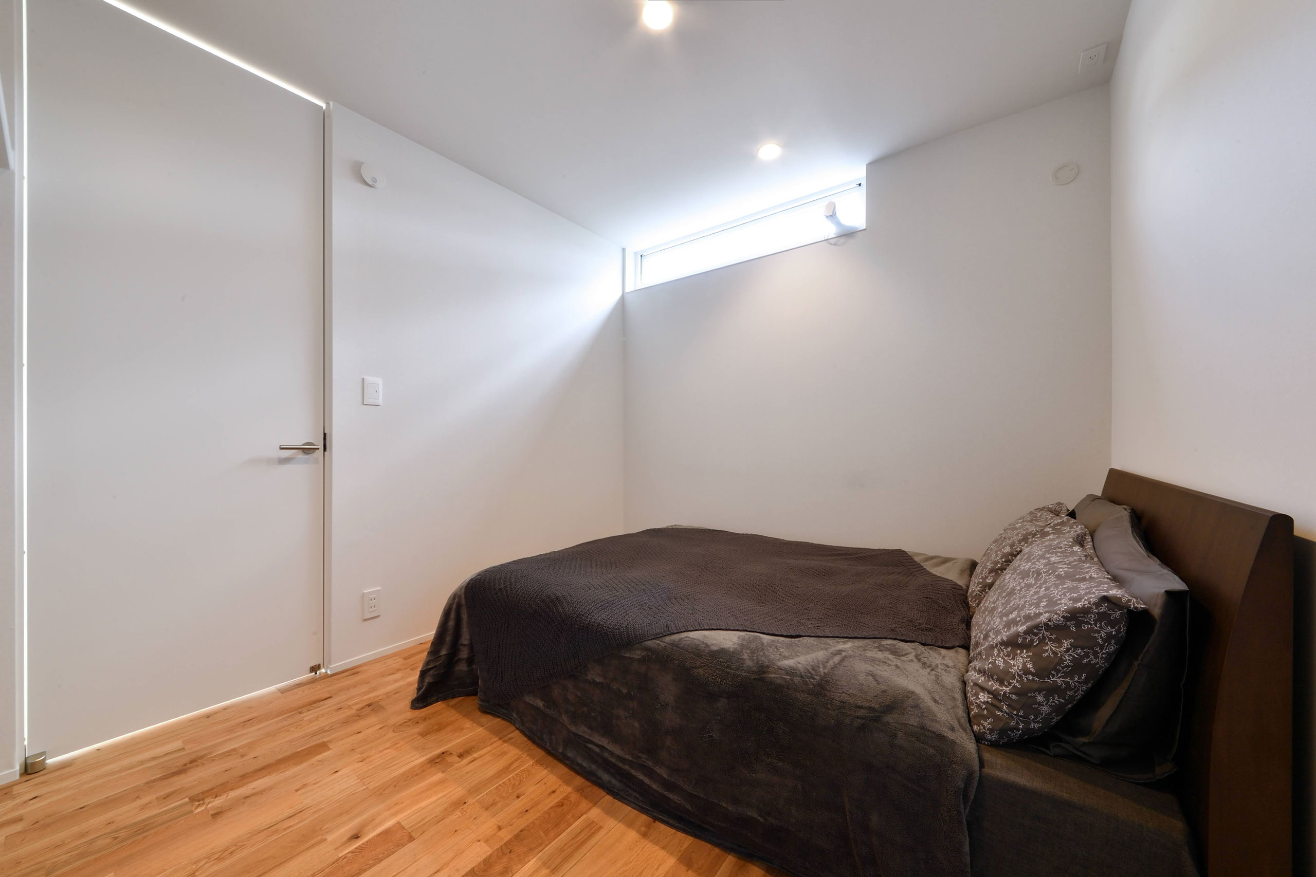 Master bedroom with high window