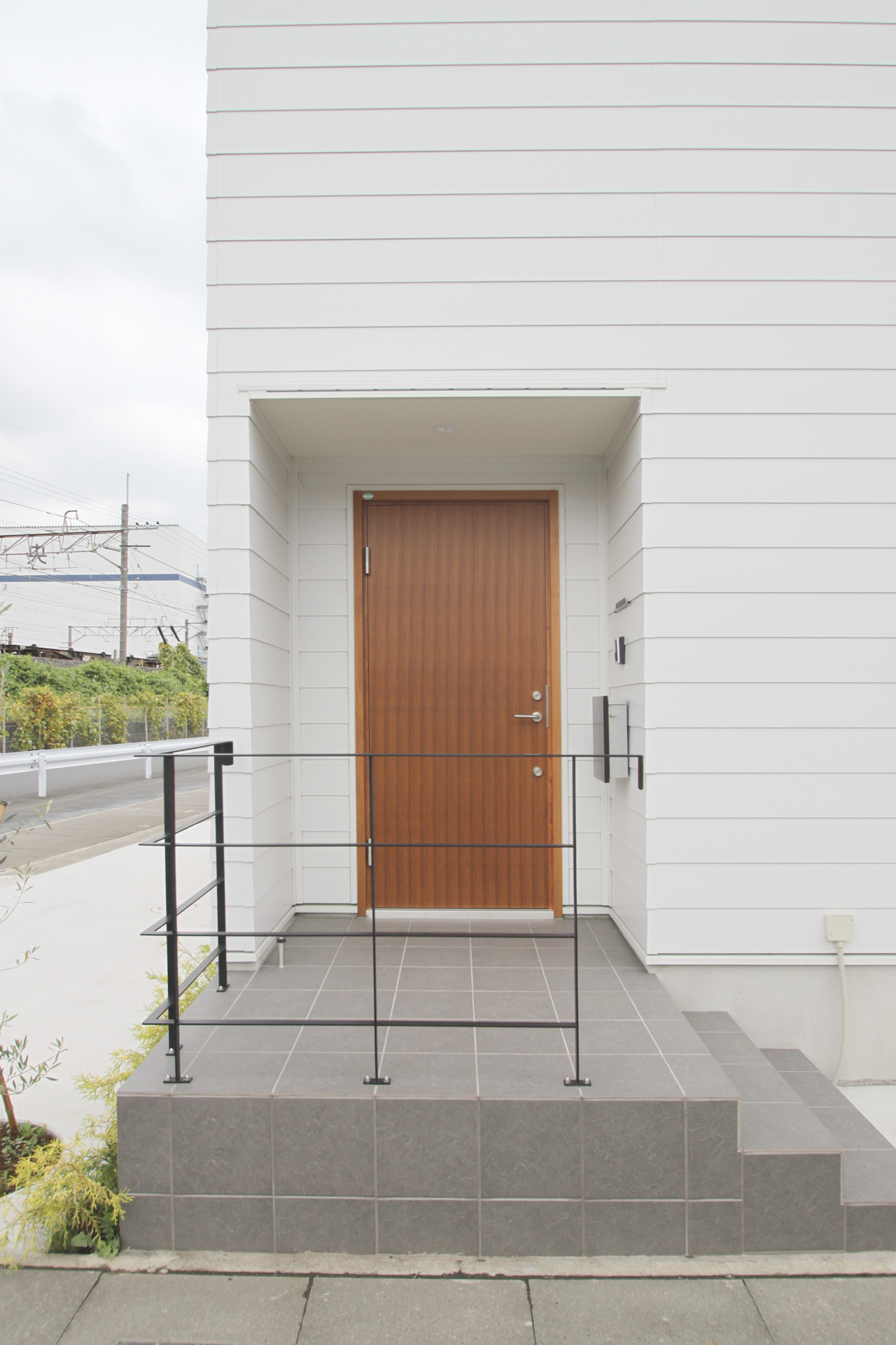 Porch with steel handrail